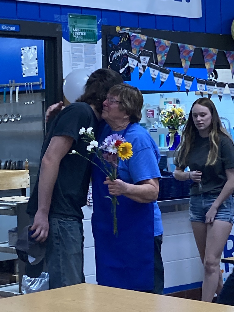 hugs from students for the retiring Cindy Bainter